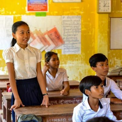 A young girl answers a question asked by a Projects Abroad volunteer teaching in Cambodia A student participates in class at one of our volunteer teaching placements in Cambodia